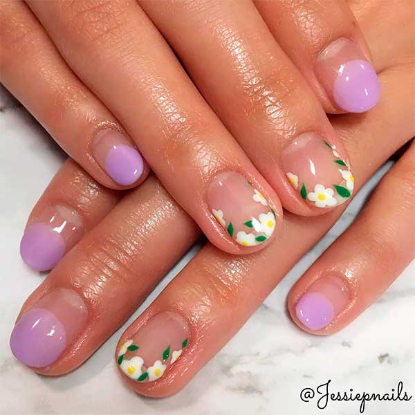 Cute light purple round French tip nails with floral nails tips design!